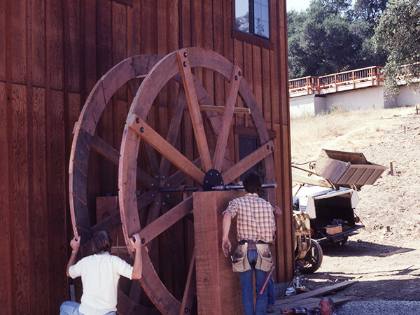 Attaching the milling wheel to the tasting room.